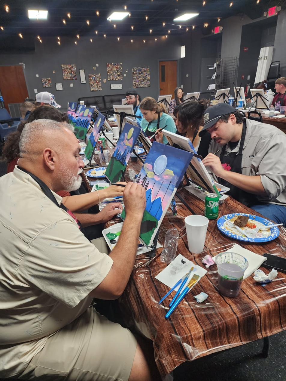 Guest painting a mountain scene